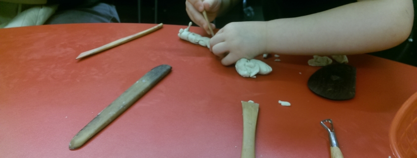 Child working with clay