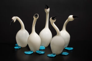 Five sculpted white glass blue-footed boobie birds