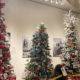 Christmas trees decorated with an assortment of items