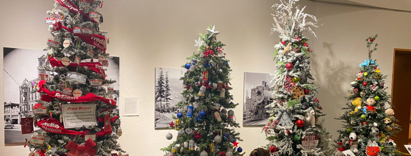 Christmas trees decorated with an assortment of items