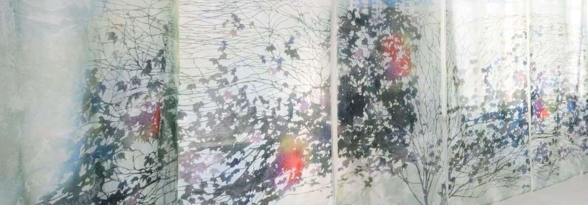 Large panel of silk organza with print of branches and leaves in black, light blue, red, orange, and other colors