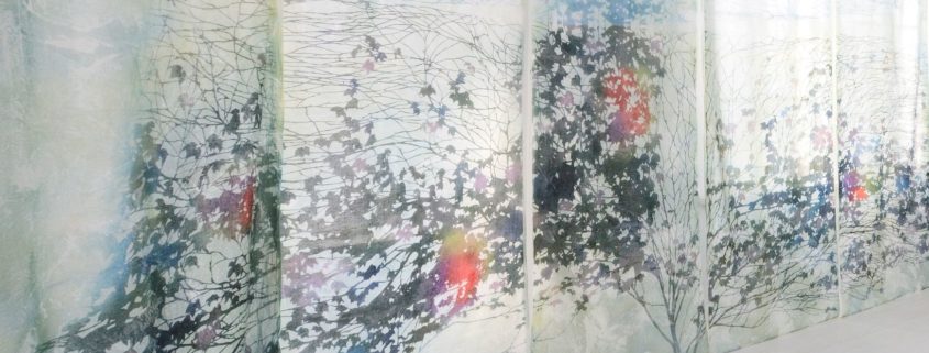 Large panel of silk organza with print of branches and leaves in black, light blue, red, orange, and other colors